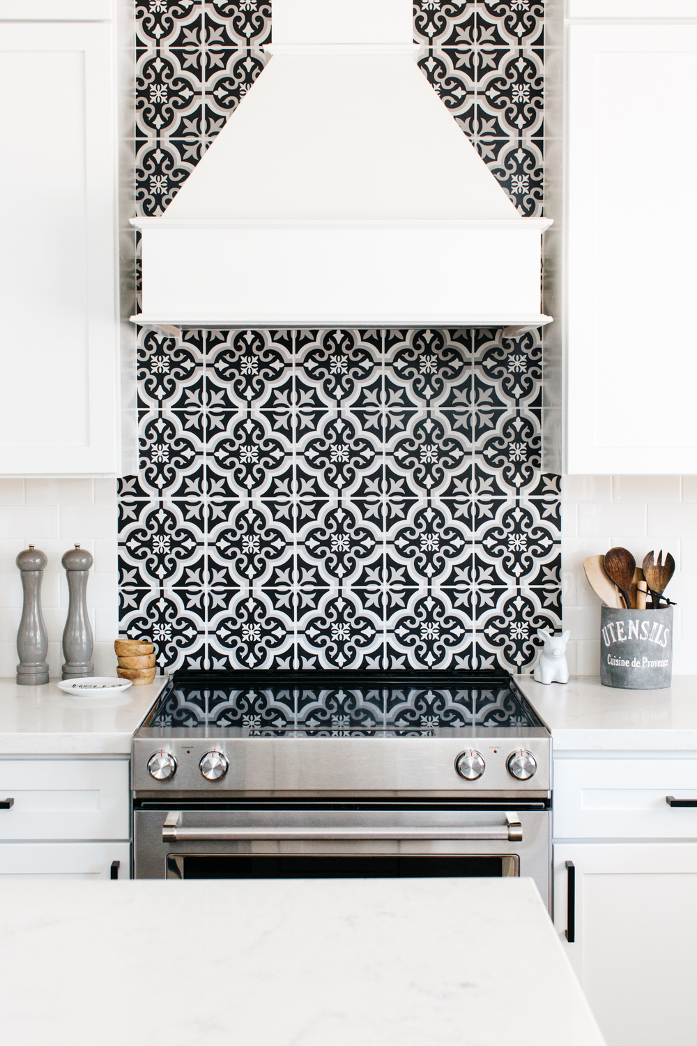 black and white patterned tile backsplash