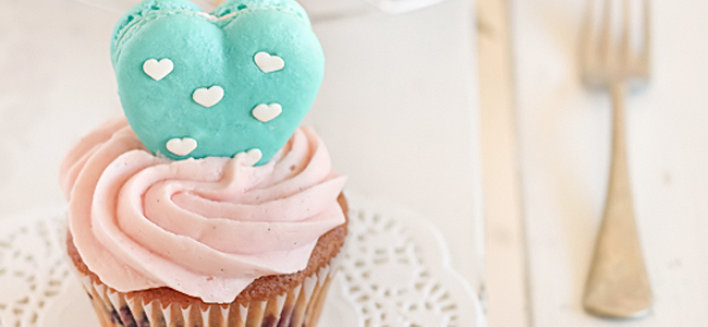 Vanilla Bean Blueberry Cupcakes with a Heart Macaron Topper from Raspberri Cupcakes via The TomKat Studio.