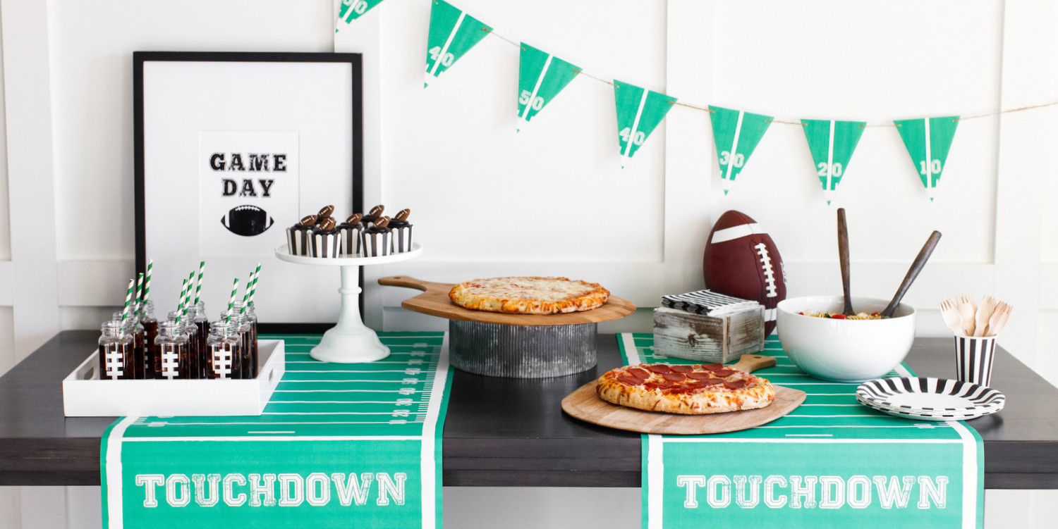 THIS POST IS SPONSORED BY DIGIORNO PIZZA Football season is in full swing and we're all rooting for our favorite team in hopes that they'll make it to the big game! Whether you're a die-hard fan (you know I am!), or just supportive of your family's love for the game, chances are there's a game day party in your future. Today, we are sharing some great ideas for food, drinks, and decor to make your party table football fan ready thanks to DIGIORNO Pizza! The best part about these ideas? They are all simple + easy to put together so you can spend less time in the kitchen, and more time cheering on your favorite team! Tip #1: Start off by personalizing our free printable invitation to send out to your guests. It's a great way to get everyone excited for game day! Tip #2: Serve a variety of DIGIORNO Original RISING CRUST pizza on your buffet table to satisfy every fan! We chose the classics: Original RISING CRUST Pepperoni and Original RISING CRUST Four Cheese. So delicious! DIGIORNO pizza helps you rise to the occasion because it is piping hot and crispy, straight out of the oven, so you can spend less time in the kitchen and more time focused on the game. Tip #3: This "Touchdown" Paper Runner from Hester & Cook is the perfect addition to your game day party table! We also used the table runner to make this adorable banner! Simply cut triangles using the yard lines as your guide and string with twine! Tip #4: Our free printable "Game Day" art print adds the perfect focal point for the party table! Simply download, print and place in a simple frame to tie in the football theme! Tip #5: Don't forget the drinks! We used French square plastic bottles with cute striped straws and filled them with root beer! To make the football threads, we used the Cricut Explore to cut white vinyl to stick on the bottles. Tip #6: Serve an easy to make and delicious side to accompany your pizza, like this Caprese Pasta Salad. Caprese Pasta Salad via pip & ebby Ingredients 16-oz. box Rotini pasta, cooked and drained 8-oz. container grape tomatoes, halved 8-oz. package Mozzarella pearls 1/2 cup fresh chopped basil 1/4 cup pesto 3 tablespoons olive oil 2 tablespoons balsamic vinegar Salt and pepper, to taste Directions: In a large bowl, combine all ingredients and mix well. Cover and chill until ready to serve! Tip #7: What's a party without dessert? Pick up or bake your favorite cupcakes! We made ours in striped baking cups to match the football theme and added cute little candy footballs! Ready to host your own game day celebration? Be sure to serve DIGIORNO Original RISING CRUST pizza for your next celebration and make it memorable! You can find more recipes + entertaining ideas featuring DIGIORNO pizza on Instagram, Pinterest, Facebook and Twitter! Styling + Design | The TomKat Studio Party Supplies | The TomKat Studio Shop Photography | Ten22 Studio THIS IS A SPONSORED POST. THE TOMKAT STUDIO HAS RECEIVED PAYMENT AND/OR PRODUCTS FROM DIGIORNO PIZZA IN EXCHANGE FOR PROMOTING, HOWEVER ALL OPINIONS STATED ARE MY OWN AND I ONLY PROMOTE PRODUCTS I LOVE.